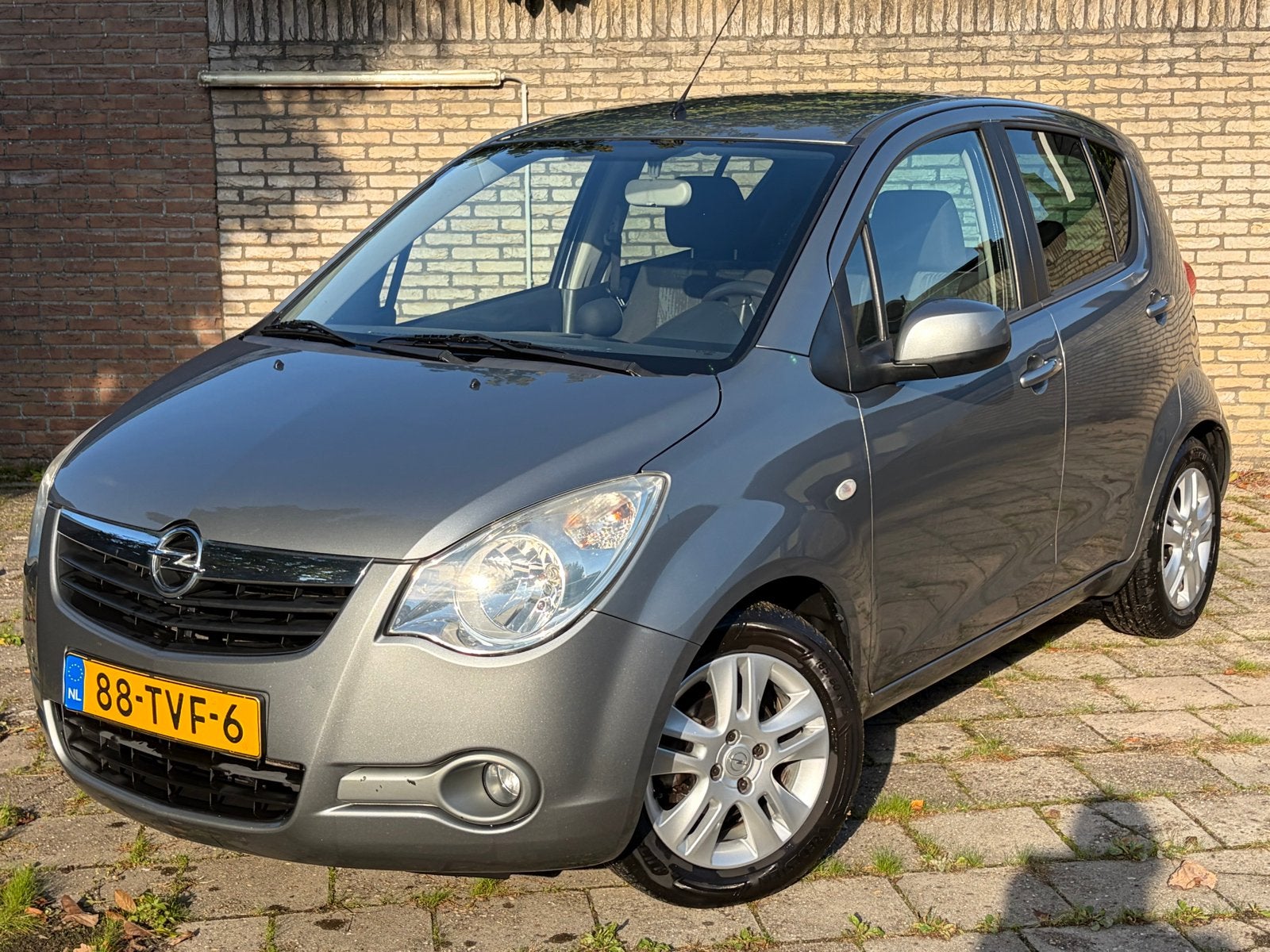 Opel Agila 1.2 16V AUTOMAAT camera 2012 125000km, Auto's, Stof, 40 €/maand, 4 cilinders, Verwarmde buitenspiegels