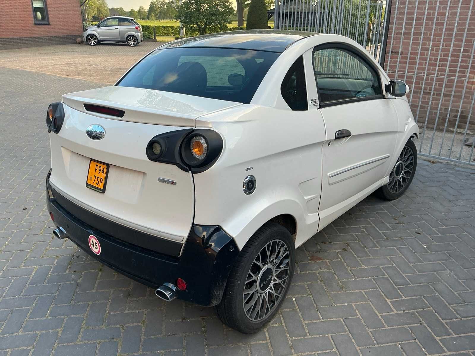 2013 Microcar Brommobiel M.GO F8C DCI 45 km, Auto's, Gebruikt, Overige carrosserieën, Origineel Nederlands, Bedrijf