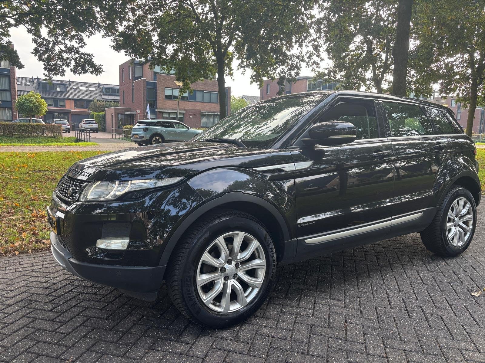 Land Rover Range Rover Evoque 2.0 Si 4WD Prestige (bj 2012), Auto's, Automaat, Euro 5, 4 cilinders, Zwart
