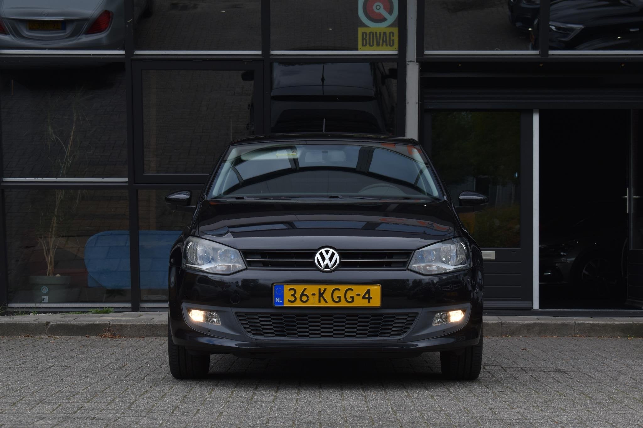 Volkswagen Polo 1.4-16V Comfortline Cruise Navi Airco Blueto, Auto's, Voorwielaandrijving, 4 cilinders, Met garantie (alle), Zwart