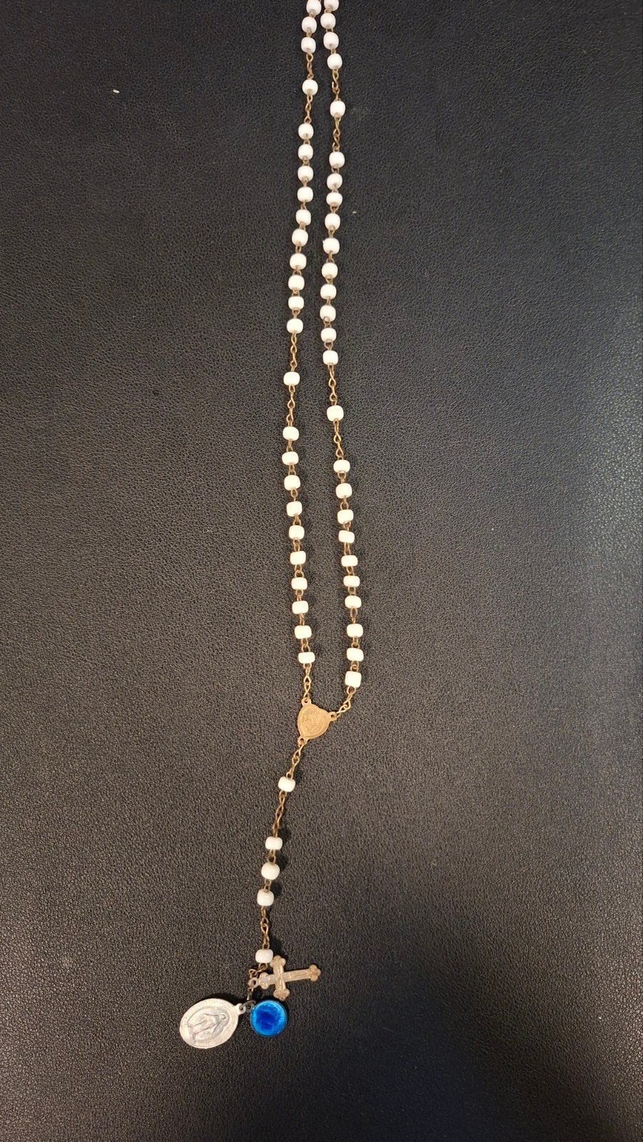 Rozenkrans met witte kralen, Ophalen