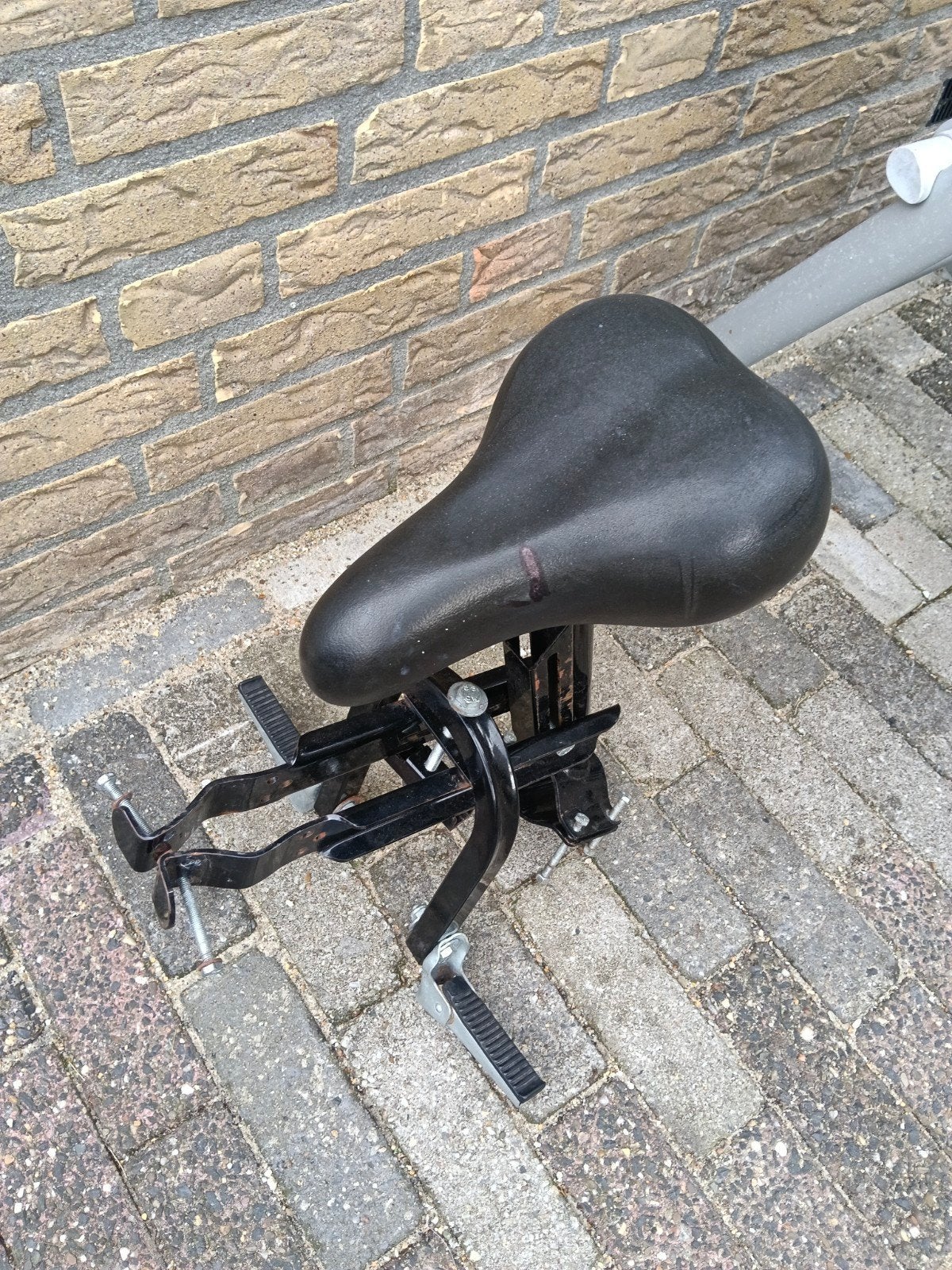 zadel voor op de stang, Ophalen
