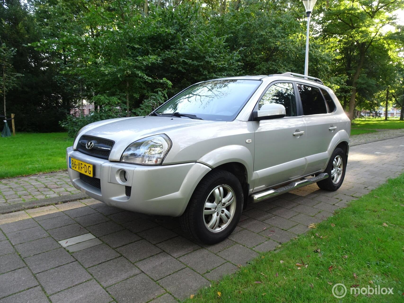 Hyundai Tucson 2.0i Dynamic|AIRCO|LEDER|STOELVER.|DEALER OND, Auto's, Dealer onderhouden, 4 cilinders, Handgeschakeld, Tucson
