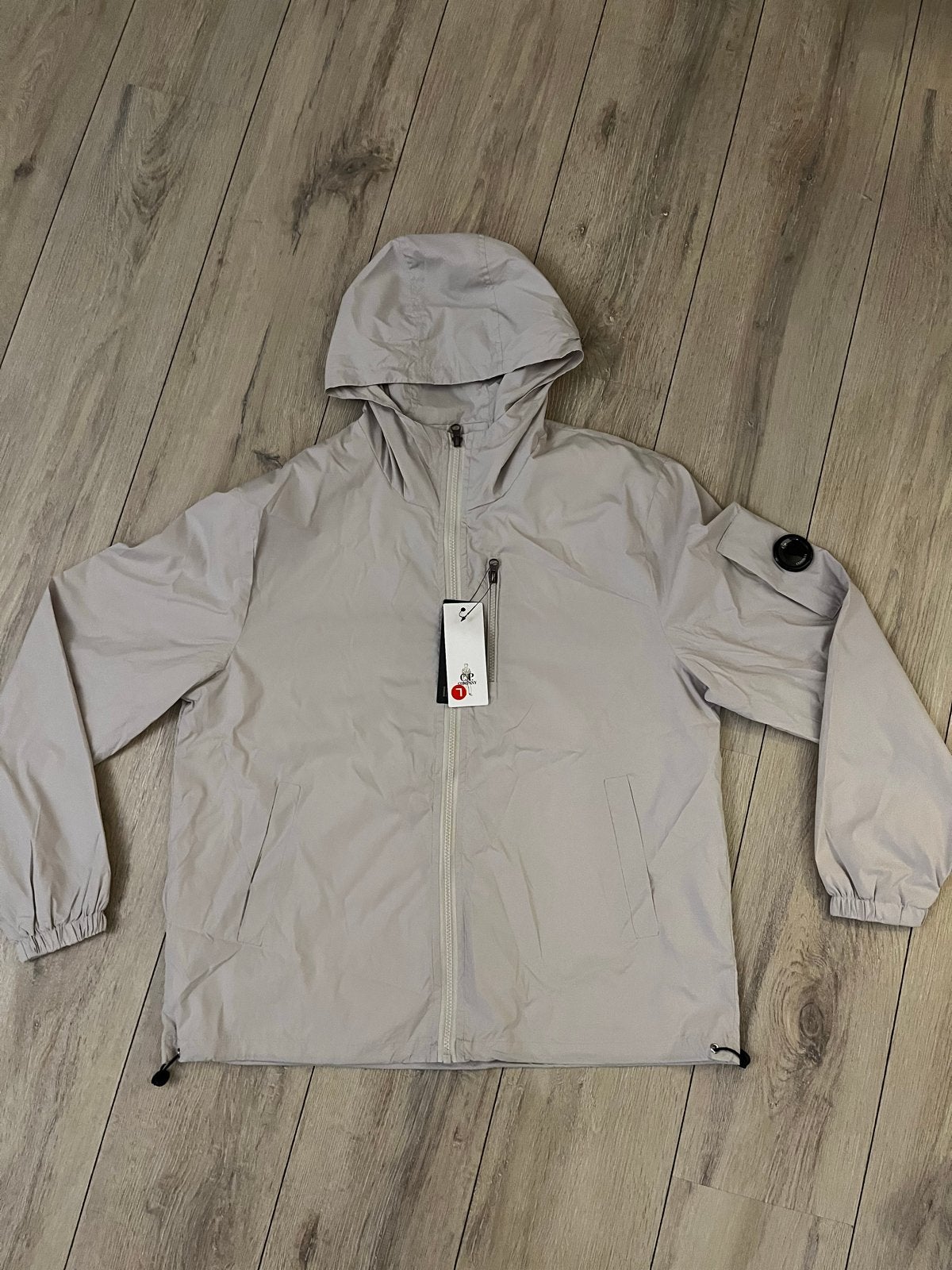C.P. Company Lichtgewicht Jas met Capuchon - Nieuw, Ophalen of Verzenden, Nieuw, Maat 48/50 (M), Beige