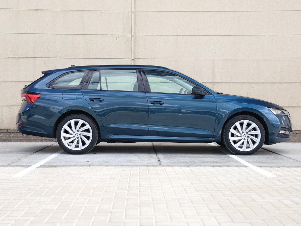 Skoda Octavia Combi 1.4 TSI iV PHEV Business Edition 204 PK, Auto's, Stof, Gebruikt, Euro 6, Blauw
