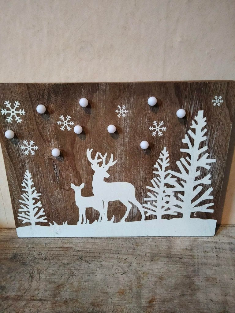 Kerst schilderij met lampjes, Ophalen