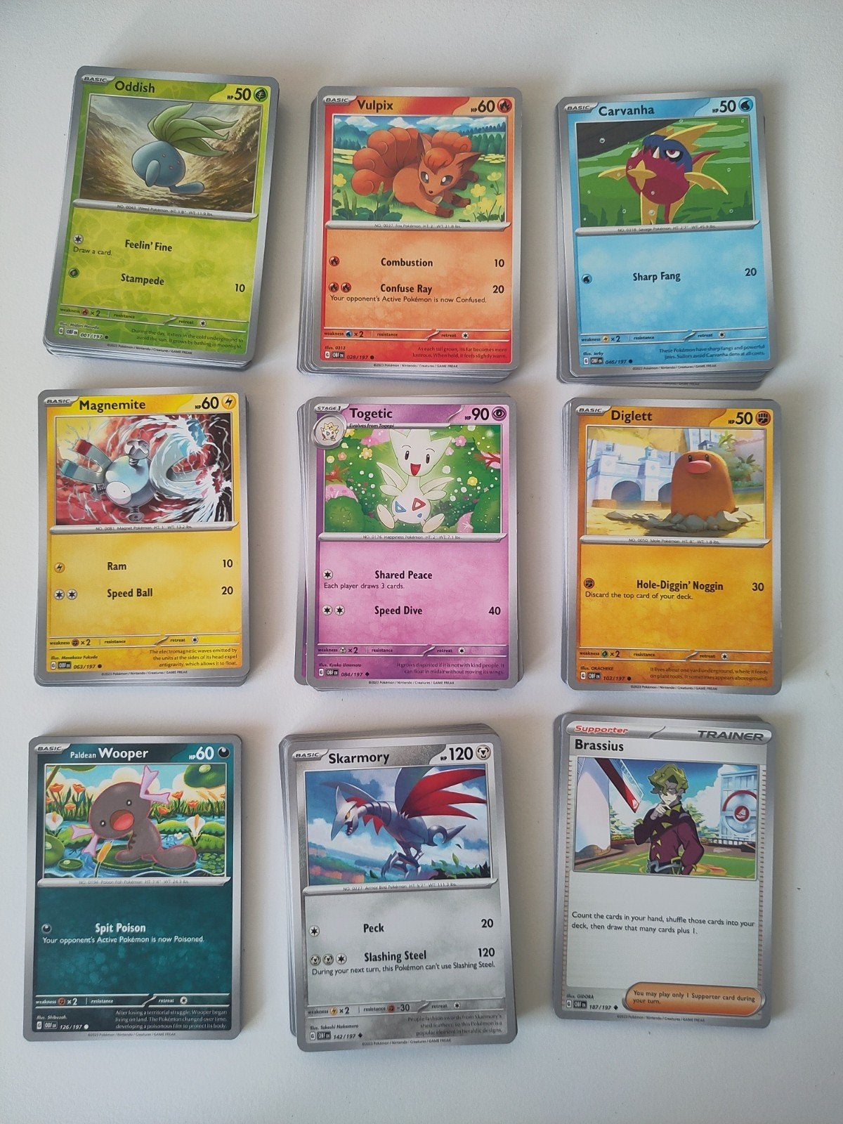 Te koop/Ruilen: Obsidian Flames bulk incl holo en rev holo, Ophalen of Verzenden, Zo goed als nieuw, Meerdere kaarten