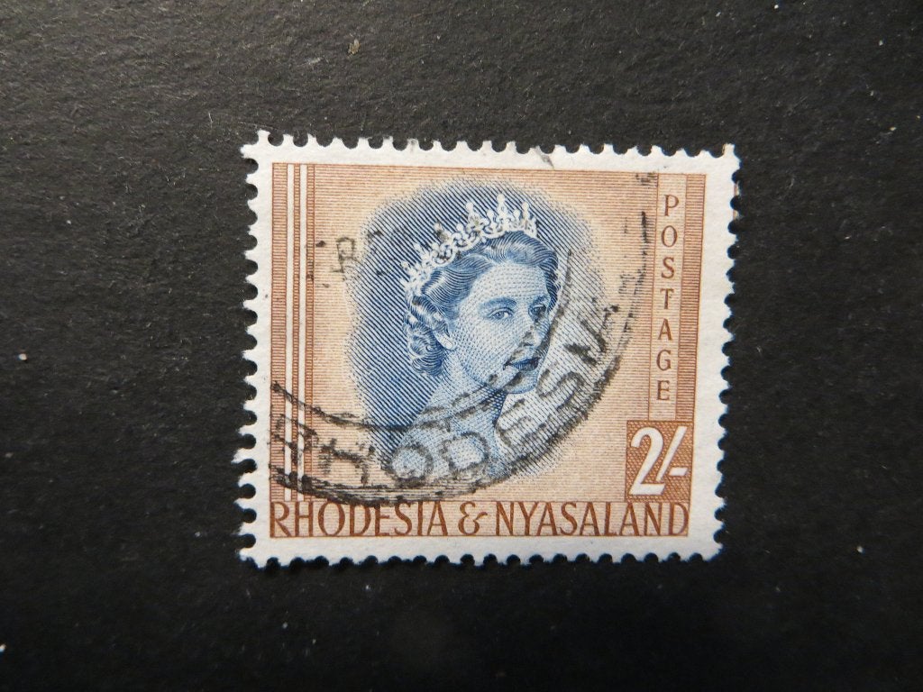 A00324: Rhodesia & Nyasaland QEII 2/-, Postzegels en Munten, Postzegels | Afrika, Ophalen of Verzenden, Tanzania