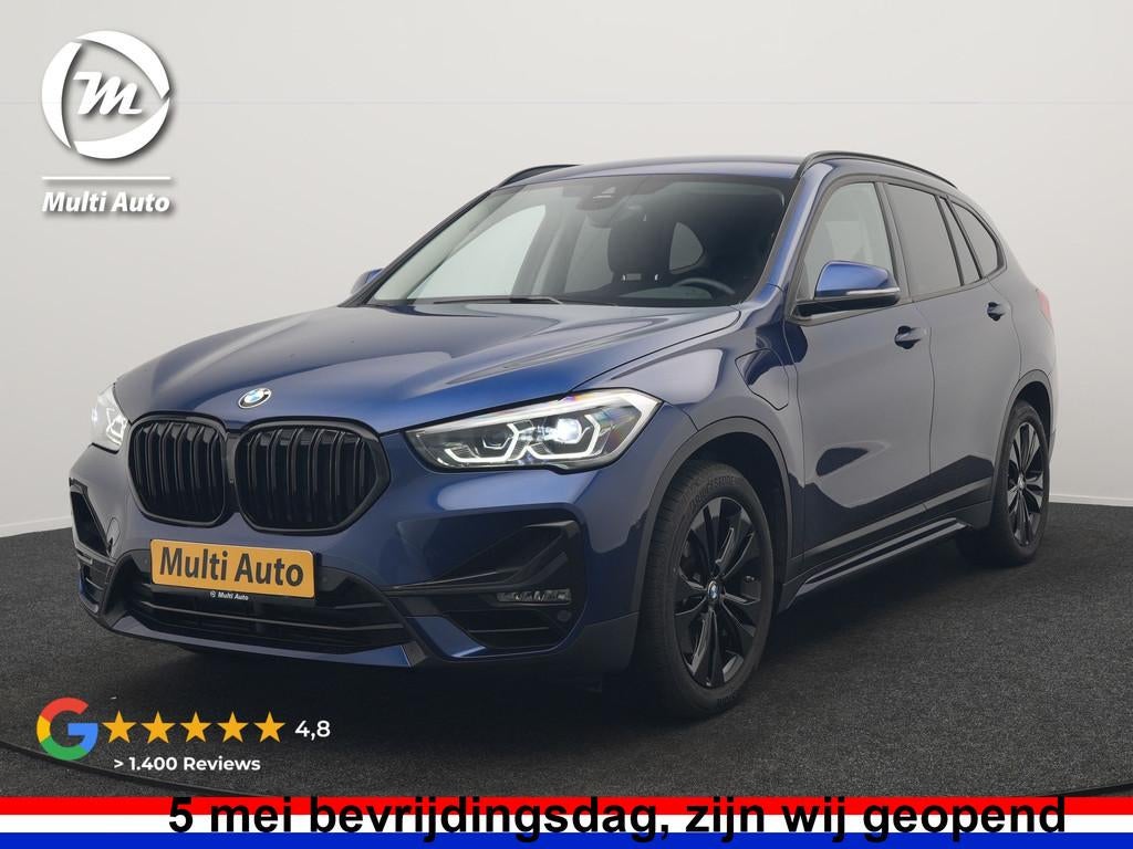BMW X1 xDrive25e Sportline PHEV 221pk Dealer O.H. | Trekhaak, Auto's, BMW, Gebruikt, Blauw, Leder en Stof, Bedrijf