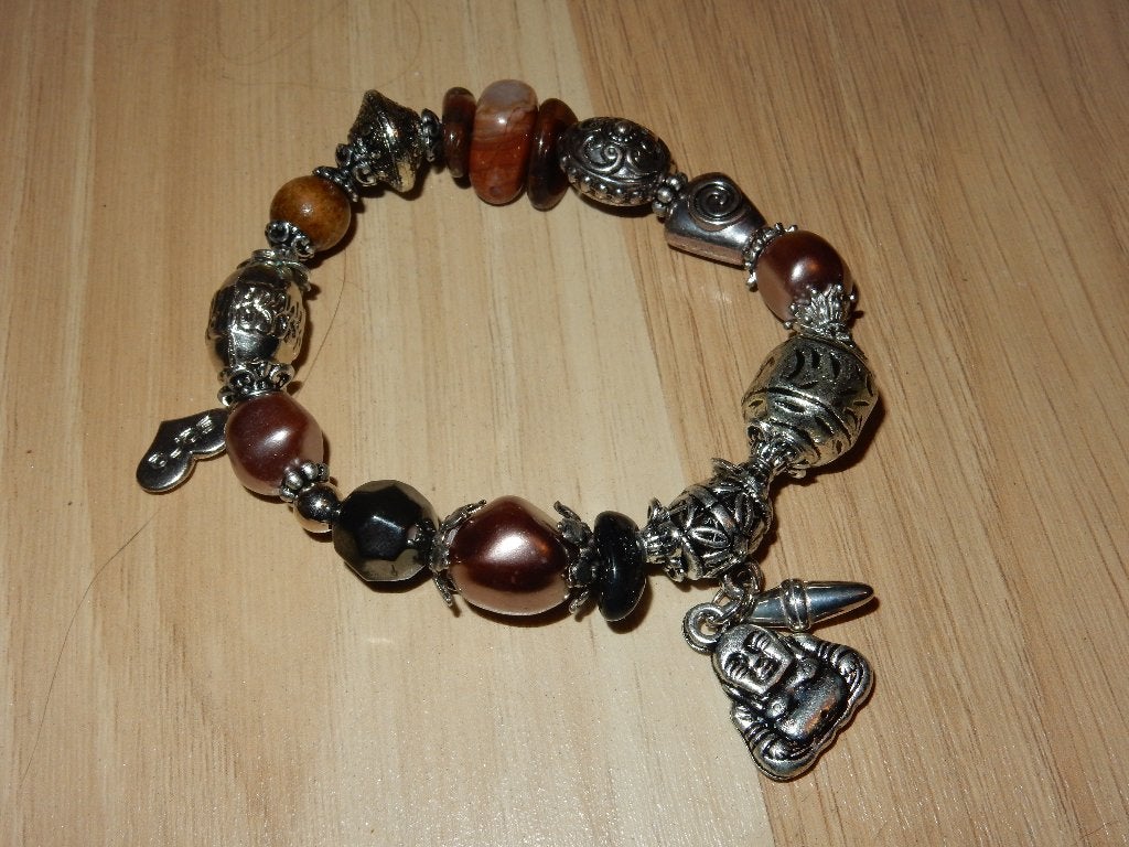 Zilverkleurige bedelarmband met kralen en boeddha bedeltje., Overige materialen, Ophalen of Verzenden, Zo goed als nieuw, Met bedels of kralen