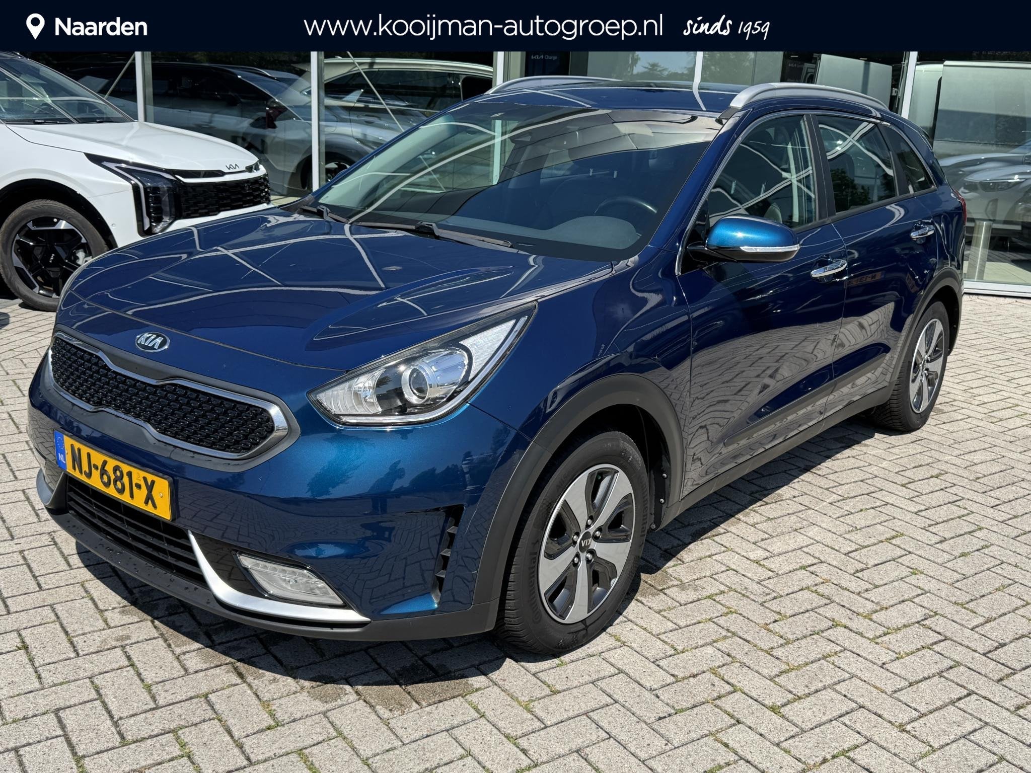 Kia Niro 1.6 GDi Hybrid First Edition, Auto's, Gebruikt, Euro 6, 2 kWh, Blauw