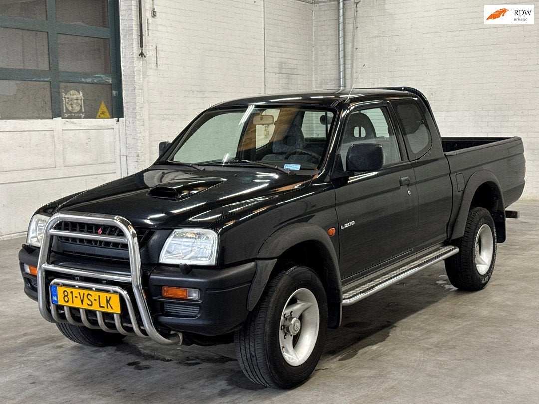 Mitsubishi L 200 2.5 Club Cab | 1e eigenaar | Trekhaak, Auto's, Gebruikt, 4 cilinders, 2477 cc, Zwart