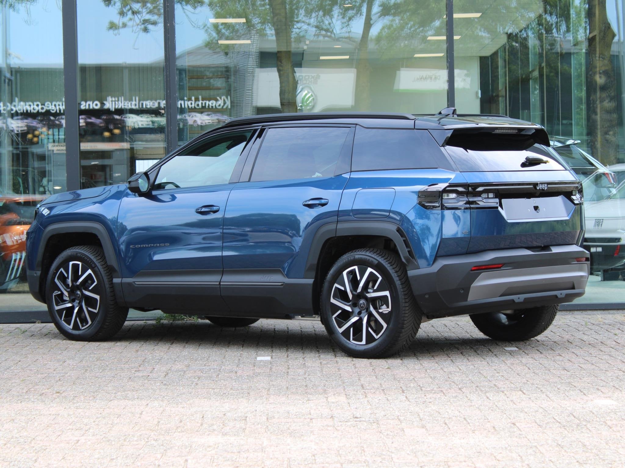 Jeep Compass First Edition 74 kWh VOORRAAD KORTING, Auto's, Jeep, 12 maanden, 213 pk, Blauw, Leder en Stof