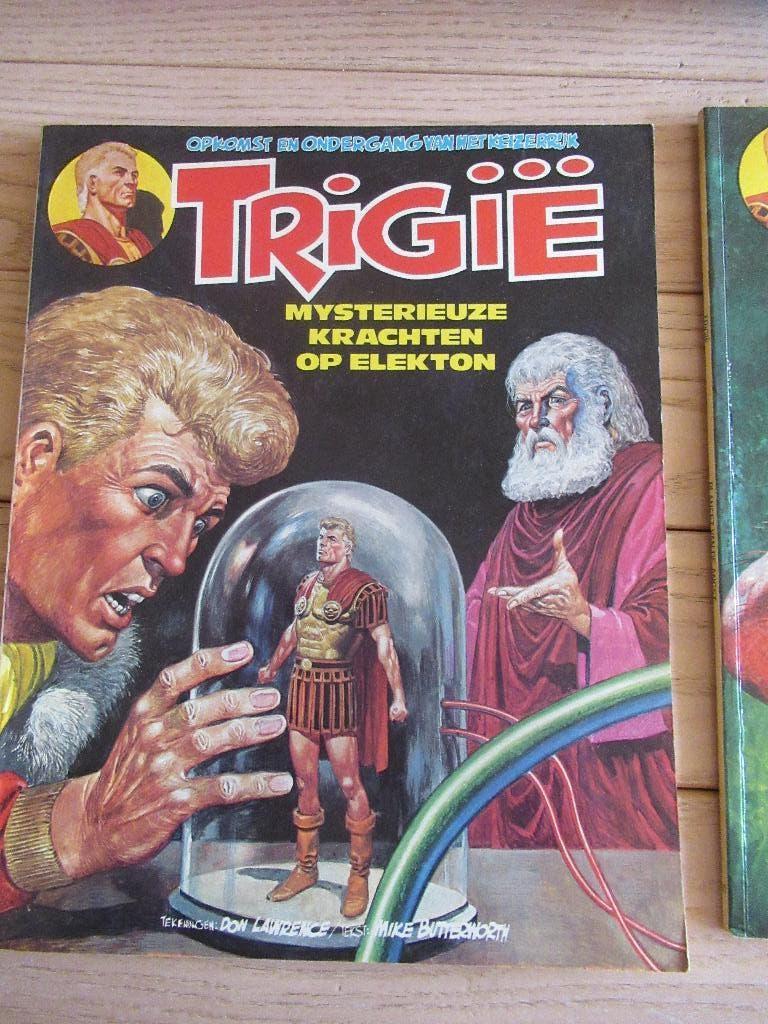 2 strips Trigie, Don Lawrence, Mike Butterworth, Ophalen of Verzenden, Zo goed als nieuw, Meerdere stripboeken