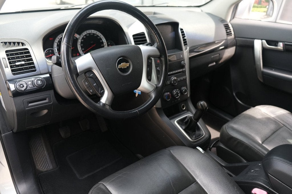 Chevrolet Captiva 2.4i Style 2WD Leder Trekhaak Pdc Airco CV, Auto's, Chevrolet, Voorwielaandrijving, 136 pk, Gebruikt, Zwart