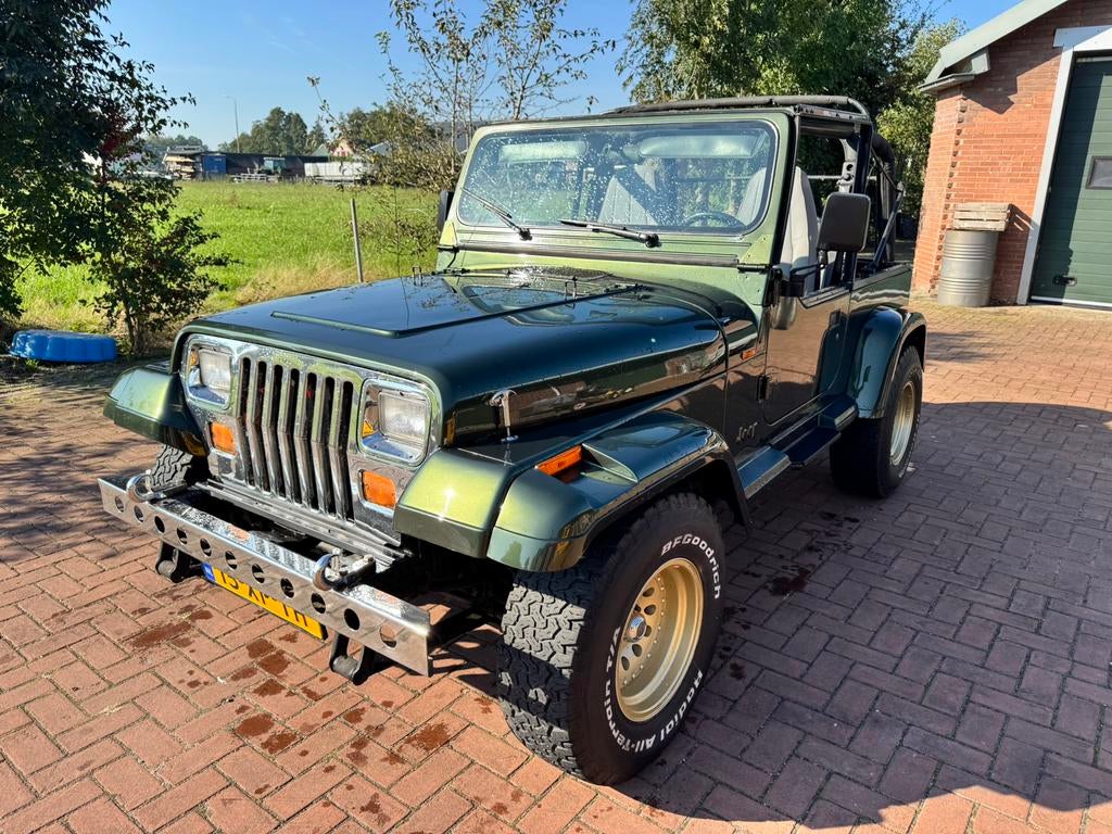Jeep Wrangler 2.5 I Softtop 4WD 1996 Groen - moet snel weg, Auto's, 121 pk, 65 €/maand, 1800 kg, 1341 kg