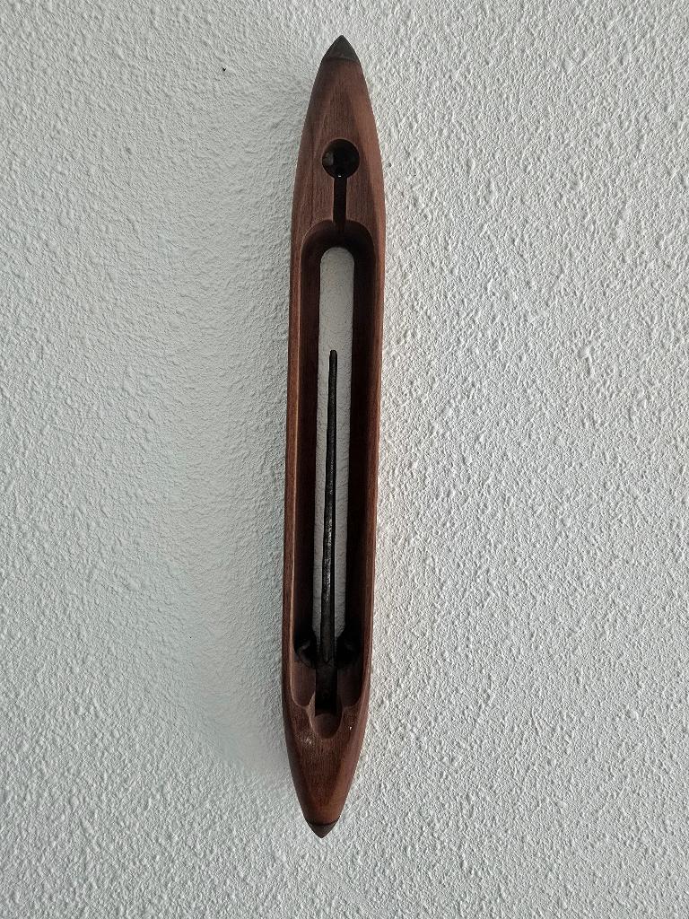 Schietspoel van een weefgetouw, Ophalen