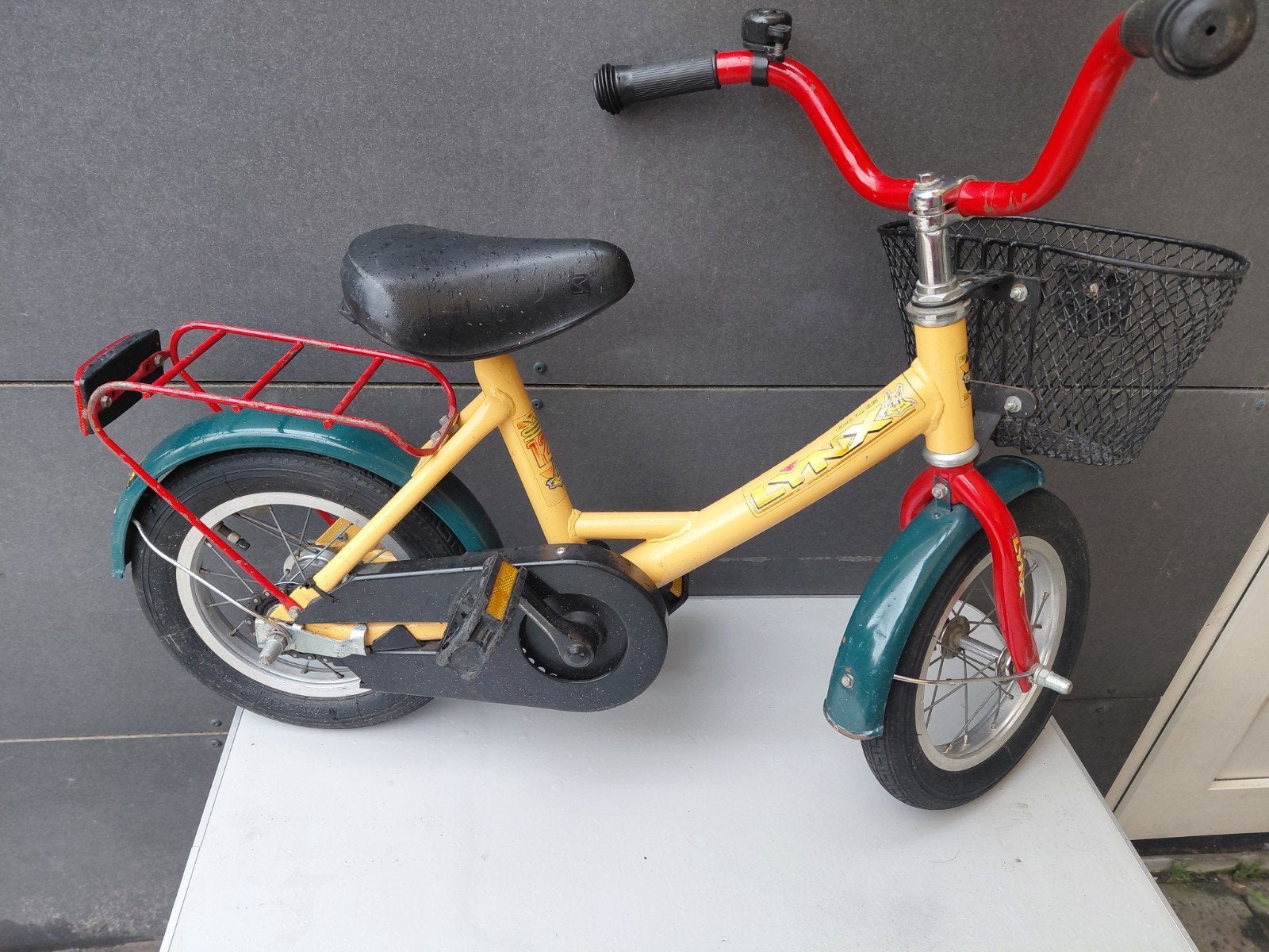 Lynx kinderfiets 12 inch - Geel met mandje, Ophalen, Terugtraprem, Gebruikt, Minder dan 16 inch
