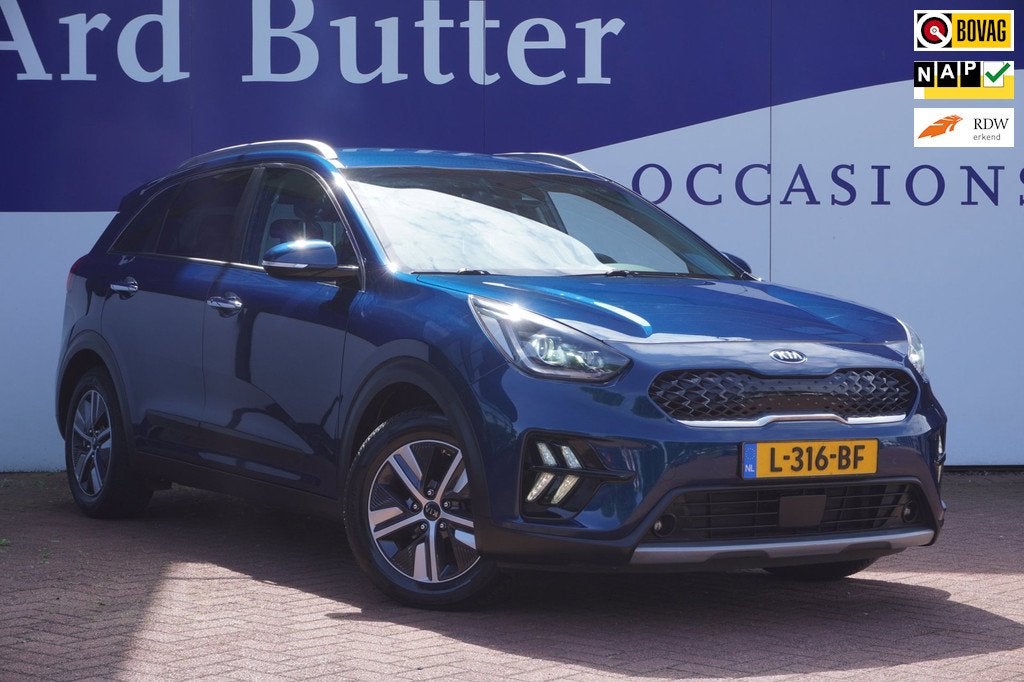 Kia Niro 1.6 GDi Hybrid DynamicPlusLine+Leder+breed-Navigati, Auto's, Gebruikt, Blauw, Automatische klimaatregeling, 1390 kg