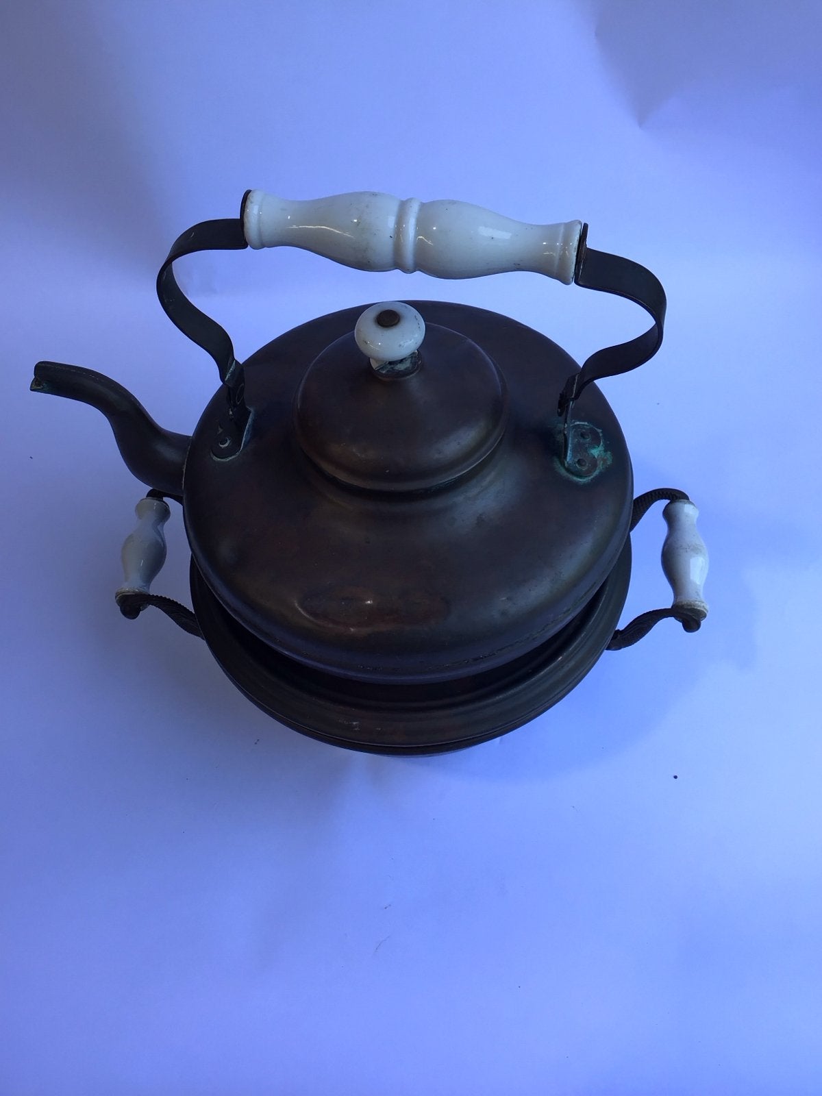 Antieke koperen theepot met rechaud, Ophalen