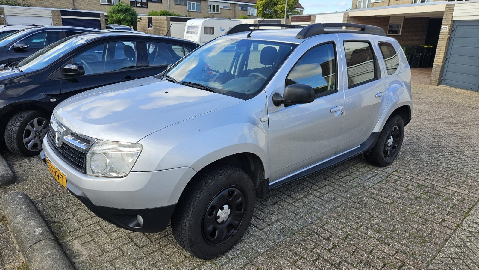 Dacia Duster 1.6 16V 4X2 2010 zilver, Auto's, Stof, Zwart, 4 cilinders, Duster