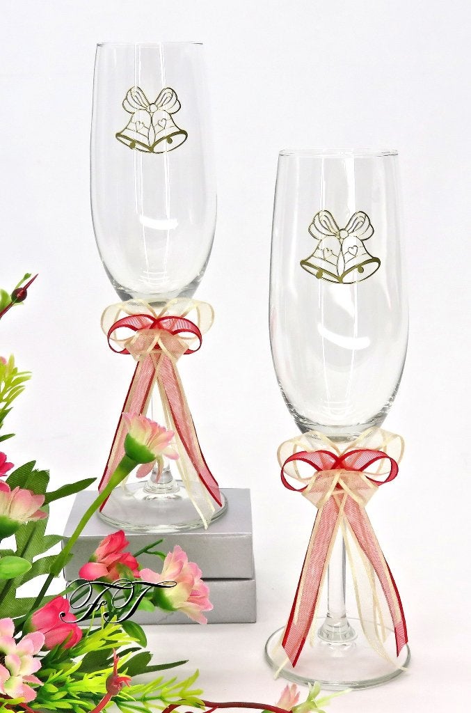 Luxe champagneglazen met ivoor en rode lint., Ophalen of Verzenden, Nieuw, Feestartikel, Geboorte of Huwelijk