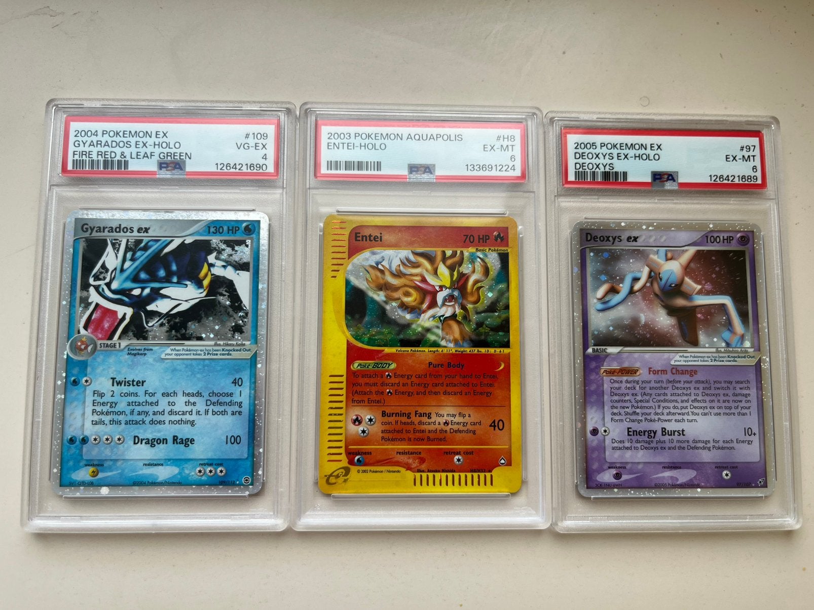 3x Pokémon PSA Slabs Gyarados ex, Entei Aquapolis, Deoxys ex, Ophalen, Zo goed als nieuw, Meerdere kaarten
