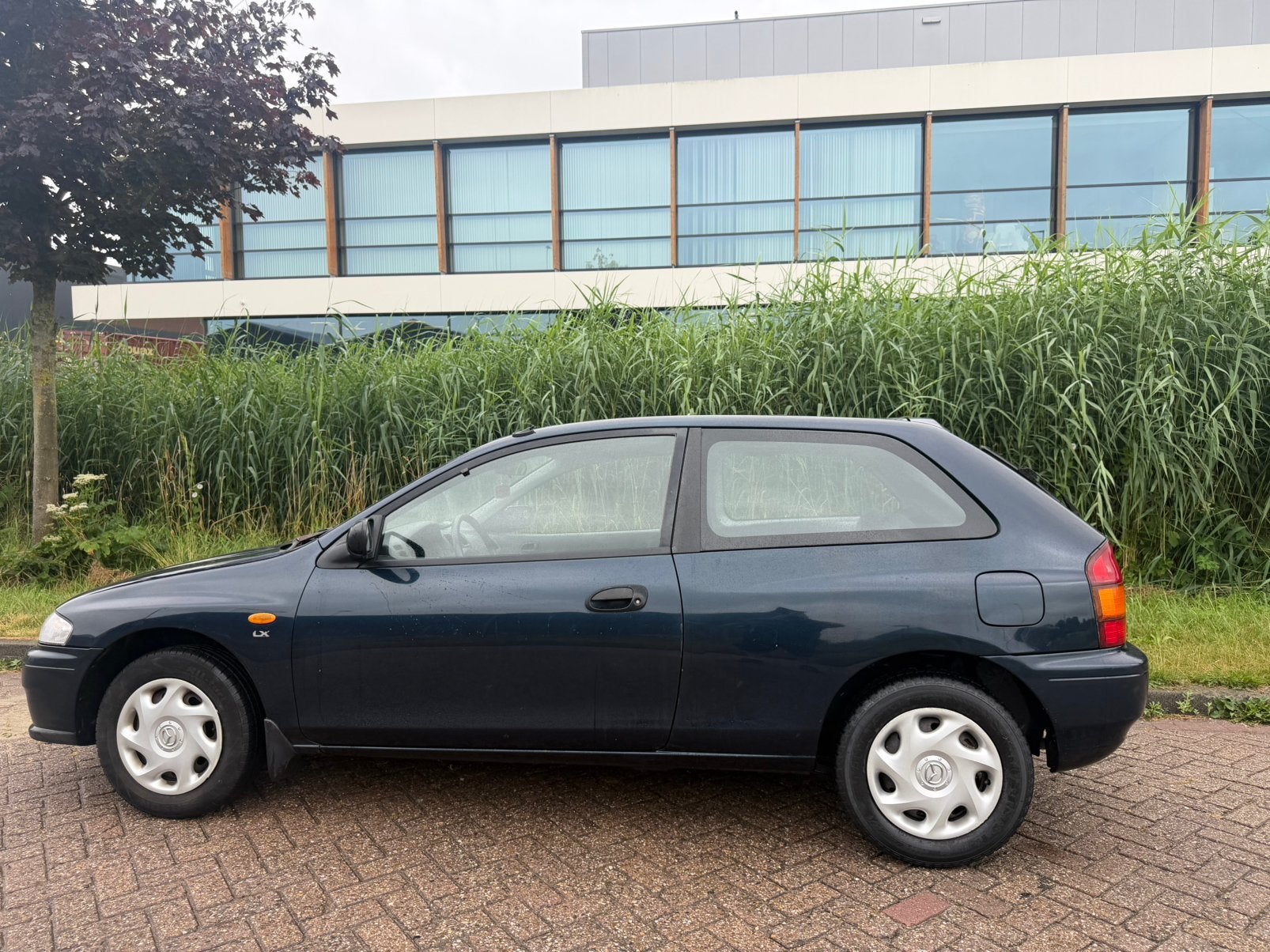 Mazda 323 1.3 P LX 1997 Groen, Auto's, Mazda, Bedrijf, Benzine, Hatchback, Handgeschakeld, Origineel Nederlands, Groen, Voorwielaandrijving