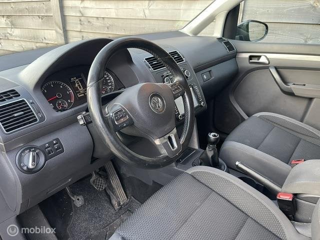 Volkswagen Touran 1.6 TDI Highline BlueMotion 7Persoons, Auto's, Voorwielaandrijving, Euro 5, Stof, Gebruikt