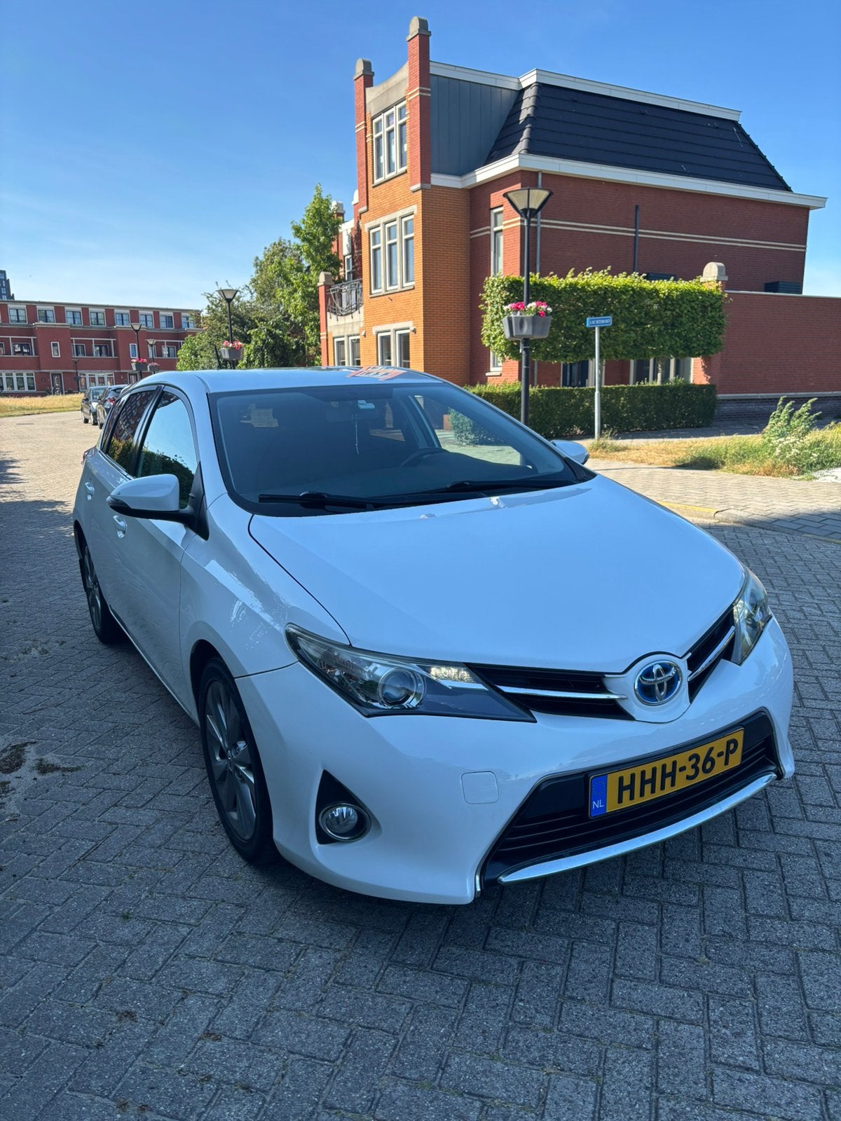 Toyota Auris 1.8 Hybrid 73KW 5D 2014 Wit, Auto's, Toyota, Stof, Zwart, Wit, 26 km/l