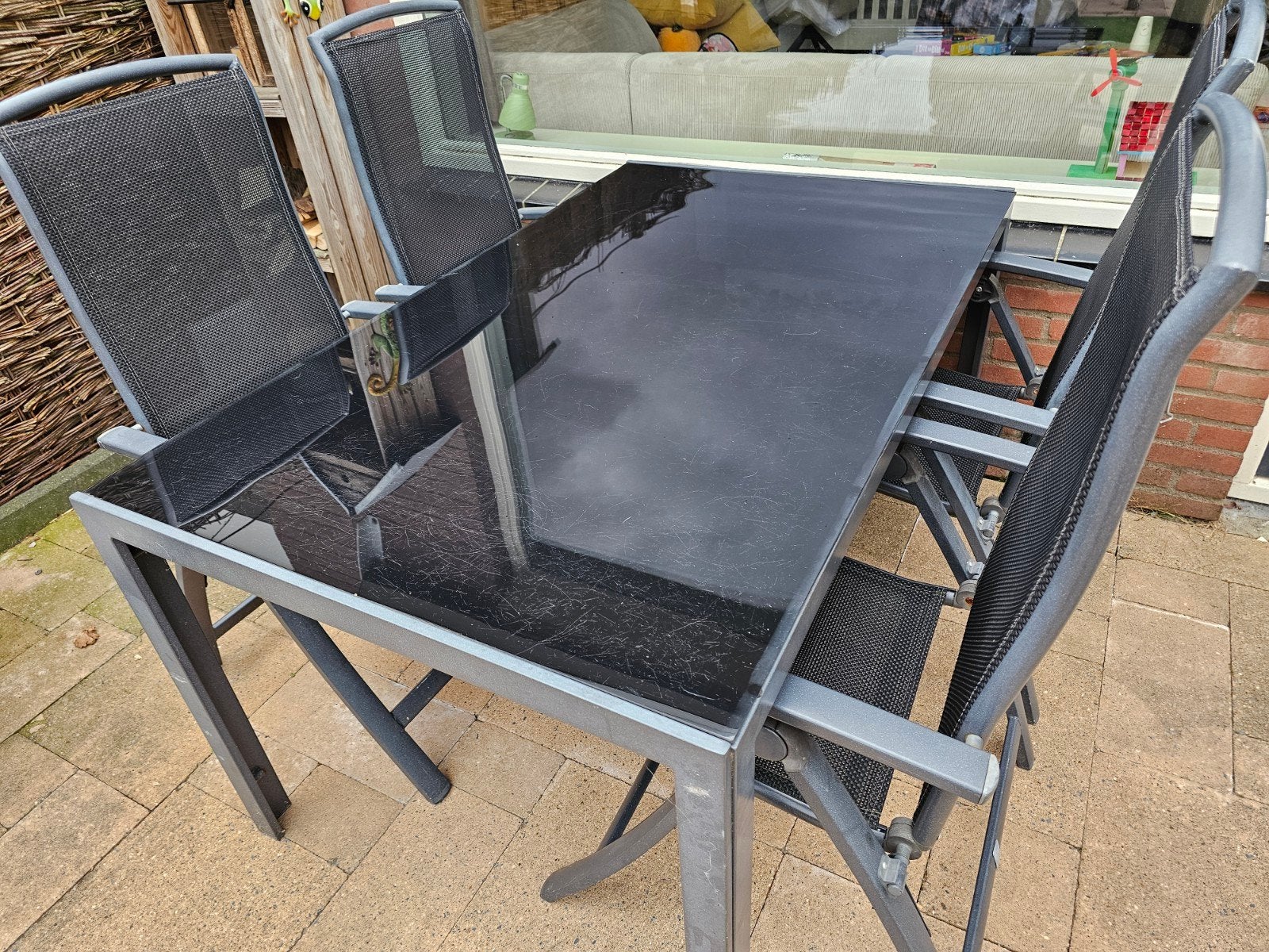 Intratuin tuinset met 4 stoelen en zwarte glazen tafel, Gebruikt, Ophalen of Verzenden, Tuinset, Eettafel