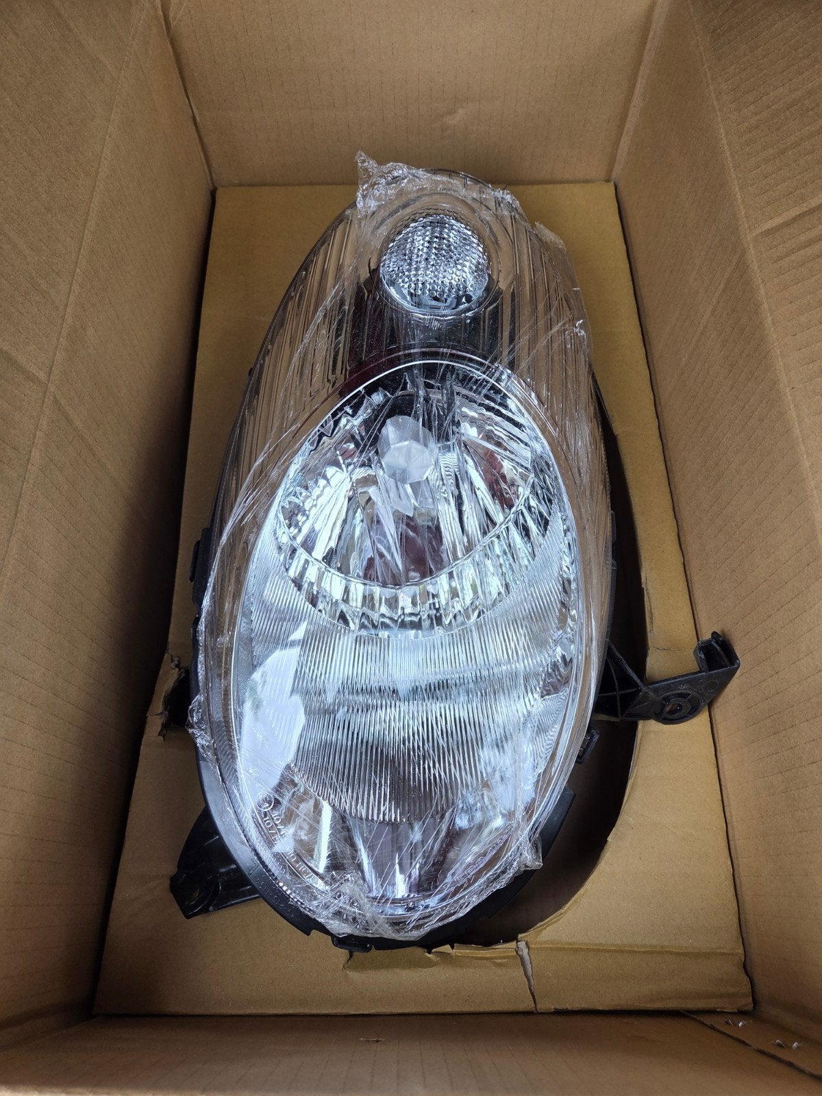 Nissan Micra K12 koplamp, Ophalen of Verzenden, Nieuw, Nissan