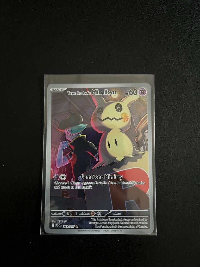Pokémon kaart Team Rocket's Mimikyu 238/217, Ophalen of Verzenden, Zo goed als nieuw, Losse kaart, Foil
