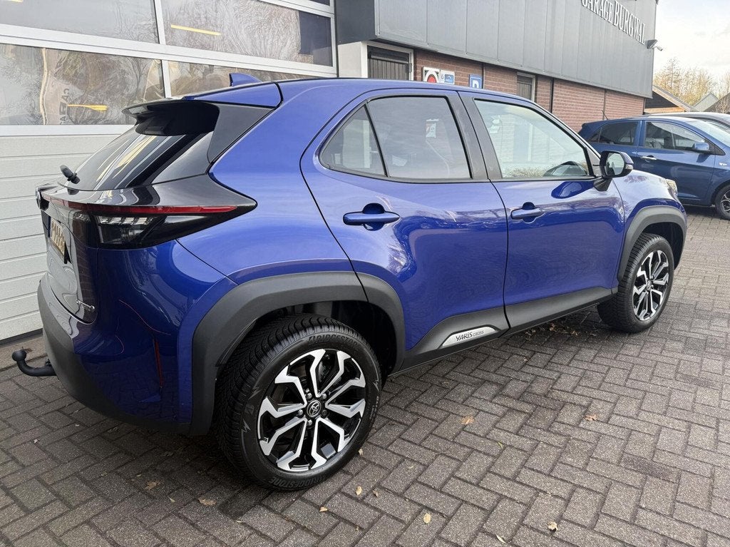 Toyota Yaris Cross 1.5 Hybrid First Edition *ALL-IN PRIJS*, 12 maanden, Stof, Gebruikt, Blauw