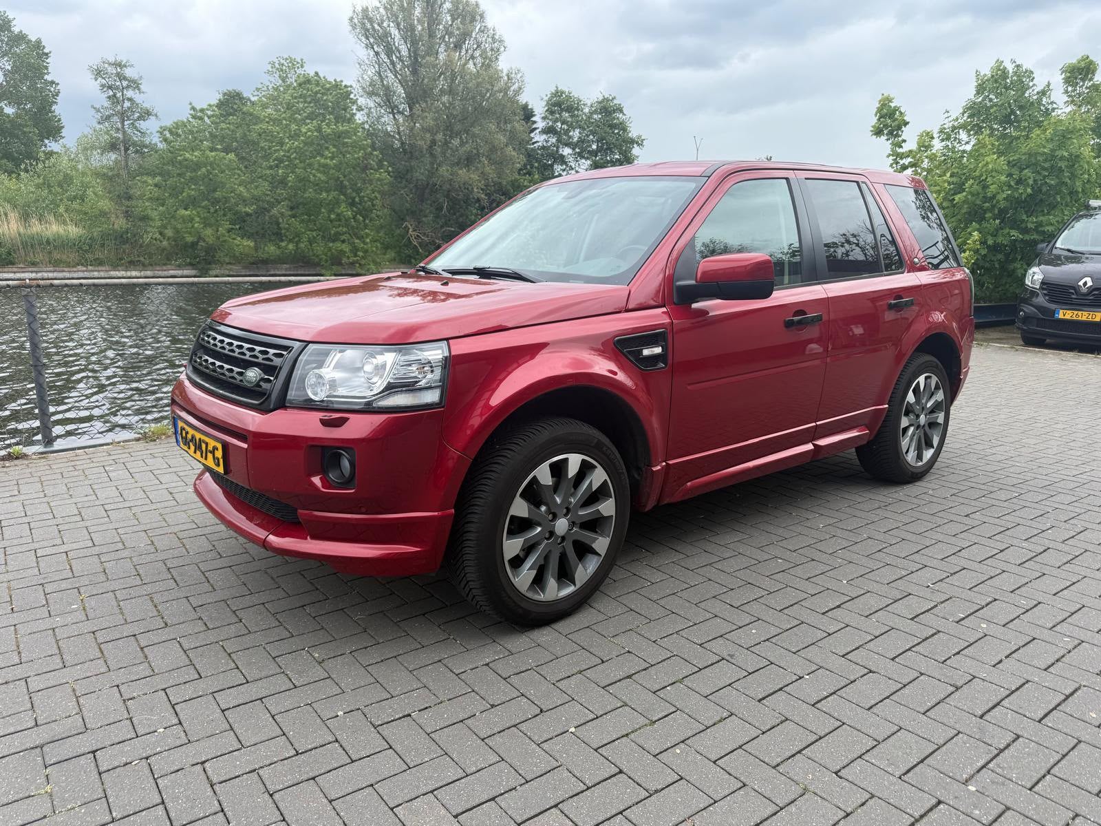 Land Rover Freelander 2.0 SI4 4WD AUT 2012 Rood, Auto's, Land Rover, Automaat, Euro 6, 2000 kg, Overige kleuren