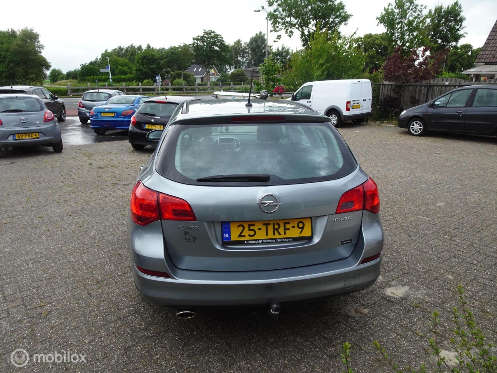 Opel Astra Sports Tourer 1.4 Turbo Edition, Auto's, Voorwielaandrijving, Euro 5, Stof, Gebruikt