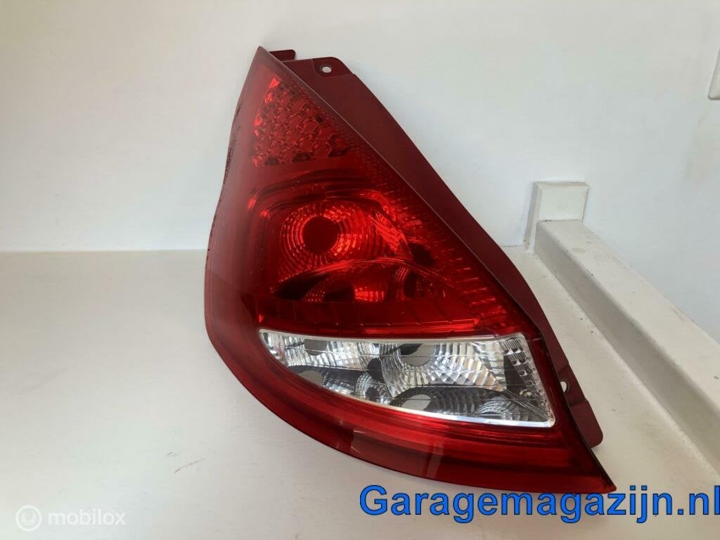 Achterlicht unit links Ford Fiesta VI ('08-'12) 8A6113405A, Gebruikt, Info@hella.com, Rixbecker STR. 75 DE 40882 Lippstadt, Ophalen of Verzenden