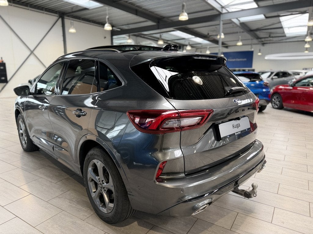 Ford Kuga 2.5 PHEV 243 pk ST-Line X | Trekhaak | AGR stoelen, Auto's, Ford, 12 maanden, Gebruikt, Zwart, 4 cilinders