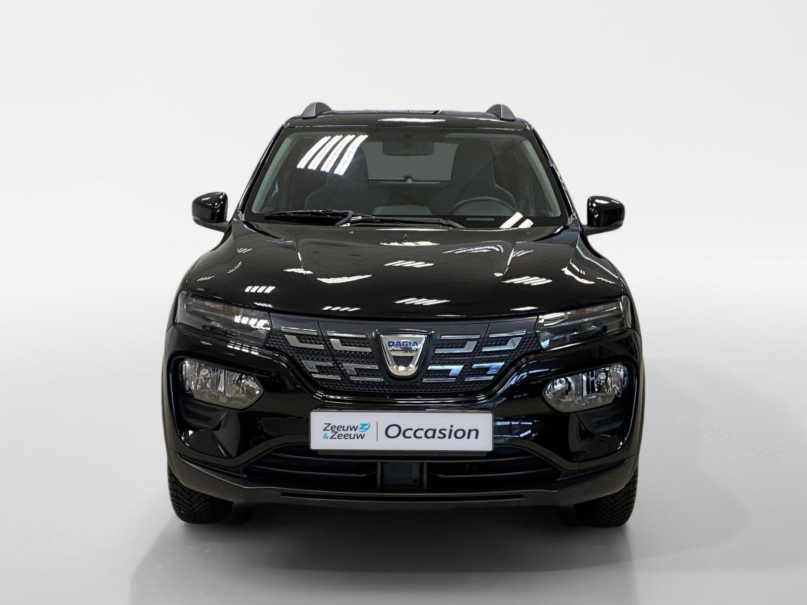 Dacia Spring COMFORT | 27KWH | AIRCO | DEALERONDERHOUDEN |, Auto's, 12 maanden, Gebruikt, Leder en Stof, Zwart