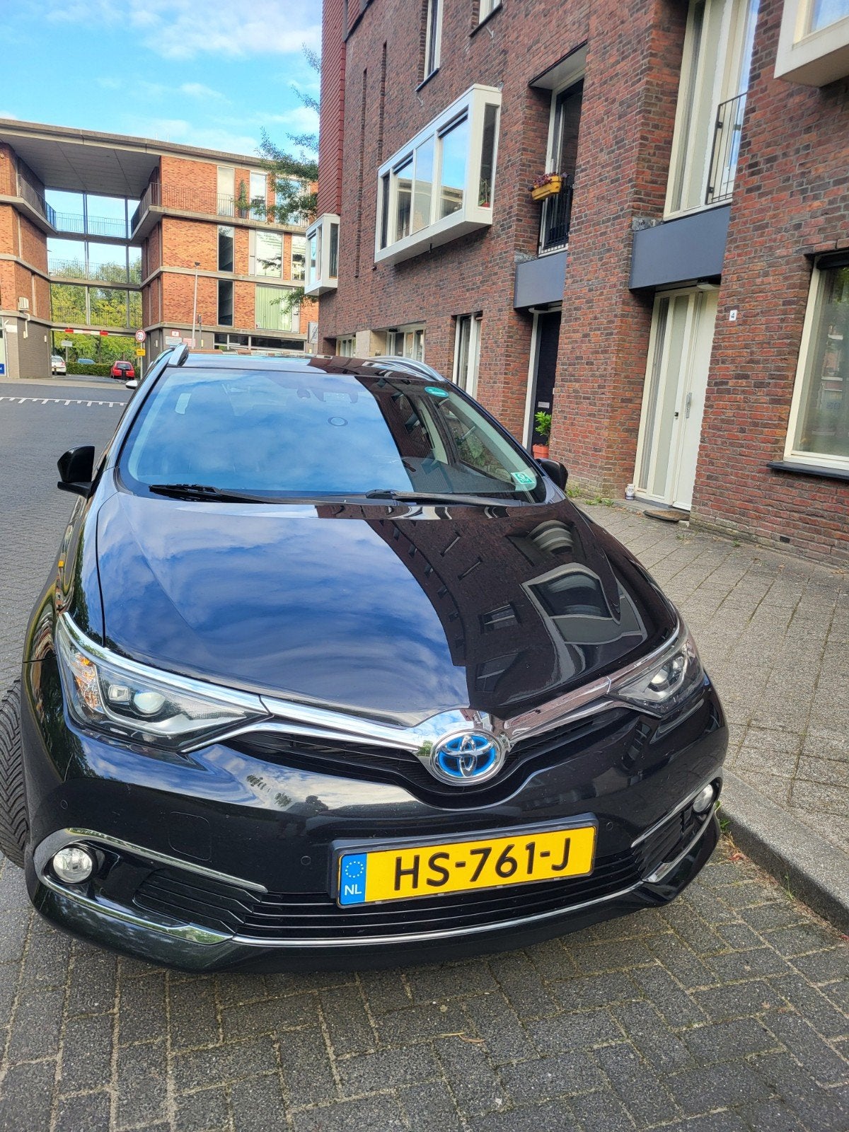 Toyota Auris 1.8 Hybrid Touring Sports CVT 2015 Zwart, Auto's, Toyota, 28 km/l, Zwart, 345 kg, Leder en Stof