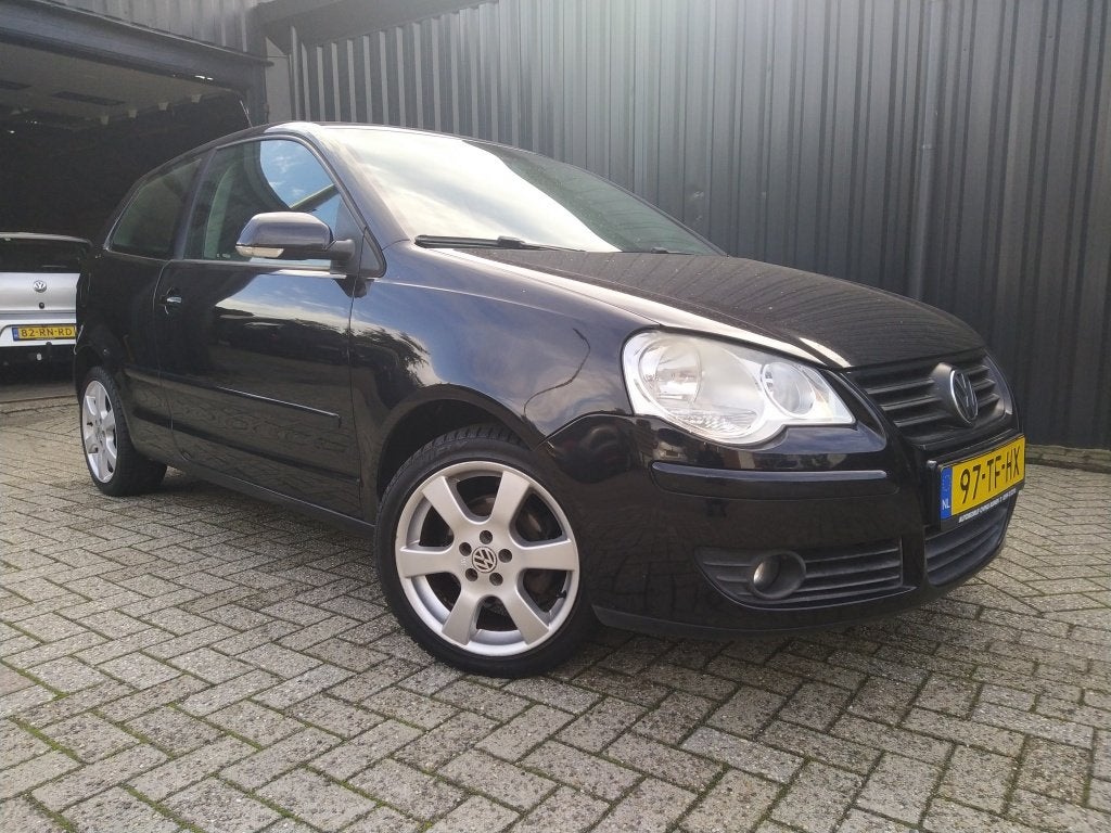 Volkswagen Polo 1.4-16V Optive (bj 2006), Auto's, Metallic lak, 4 cilinders, Zwart, Bedrijf