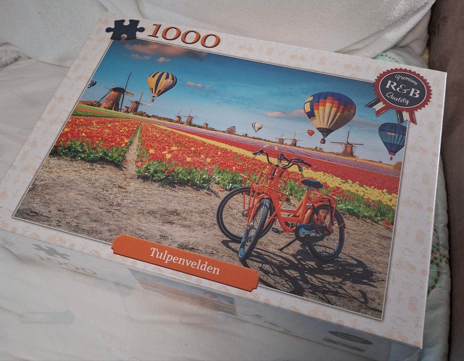 3 Legpuzzels 1000 stukjes -Taartjes -Tulpenvelden met fiets, Ophalen of Verzenden, 500 t/m 1500 stukjes, Zo goed als nieuw, Legpuzzel