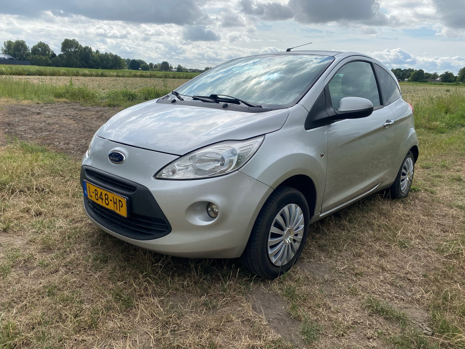 Ford Ka 1.2 51KW 2010 Grijs, Auto's, Voorwielaandrijving, Stof, 4 cilinders, 4 stoelen
