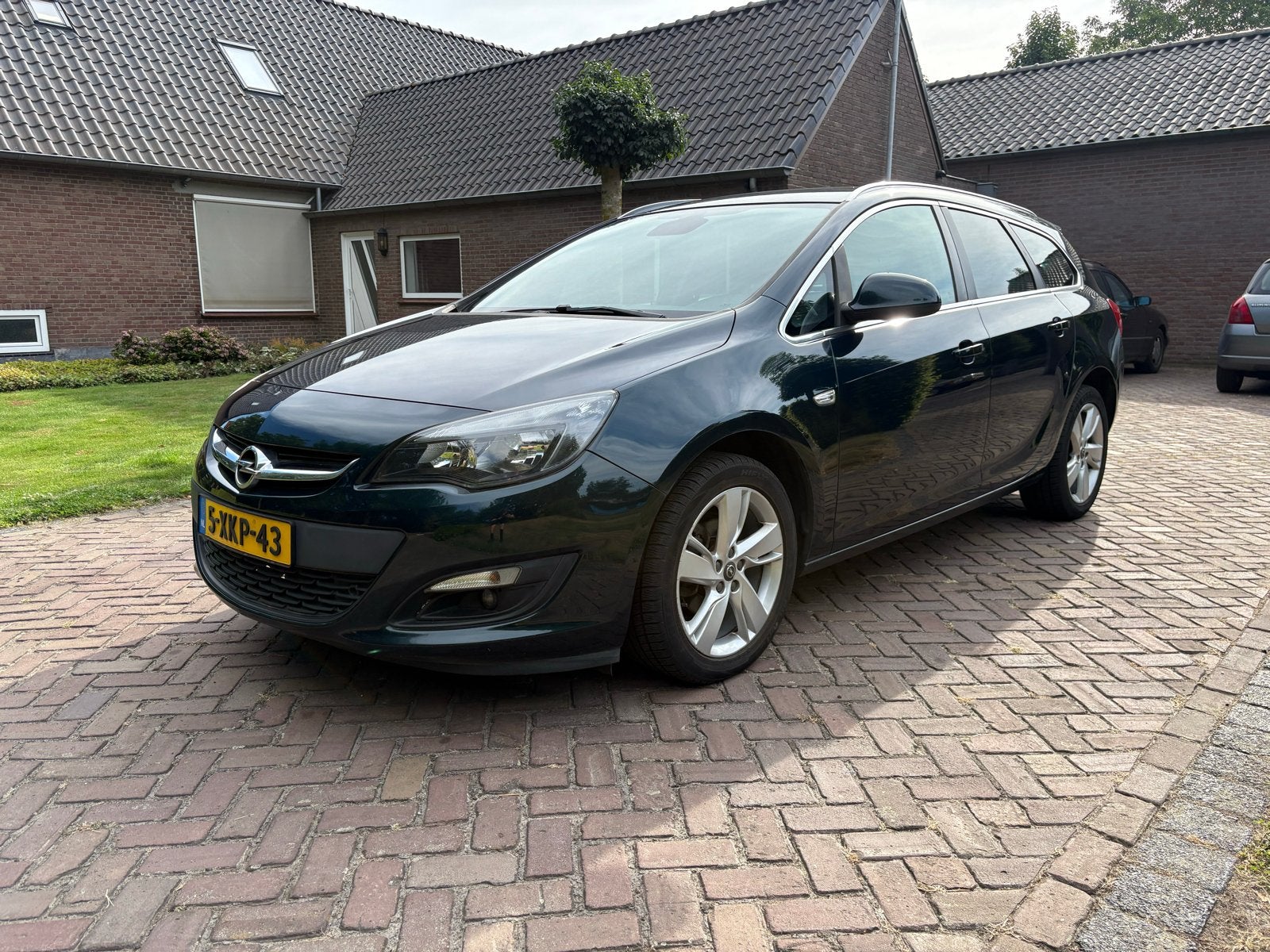 Opel Astra 1.4 Turbo 103KW ST 2014 Groen, Auto's, Voorwielaandrijving, 4 cilinders, Navigatiesysteem, Origineel Nederlands