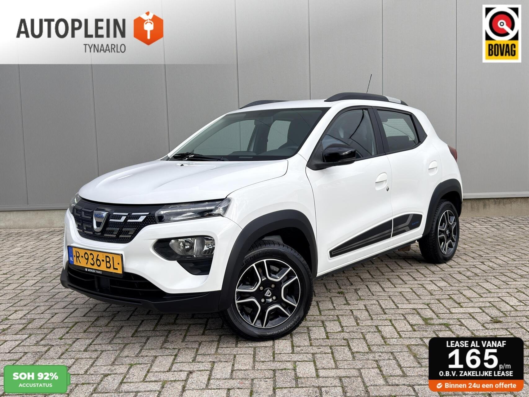 Dacia Spring Comfort Plus (Orange Pack) 27 kWh Carplay|Camer, Auto's, Gebruikt, Met garantie (alle), 230 km, Wit