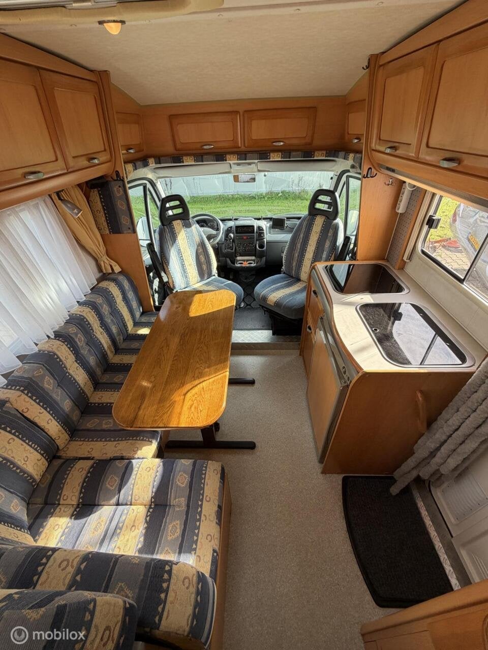 Hymer T Tramp 575 l Frans bed l 110PK l L-zit, Ringverwarming, Tot en met 2, Bedrijf, Half-integraal