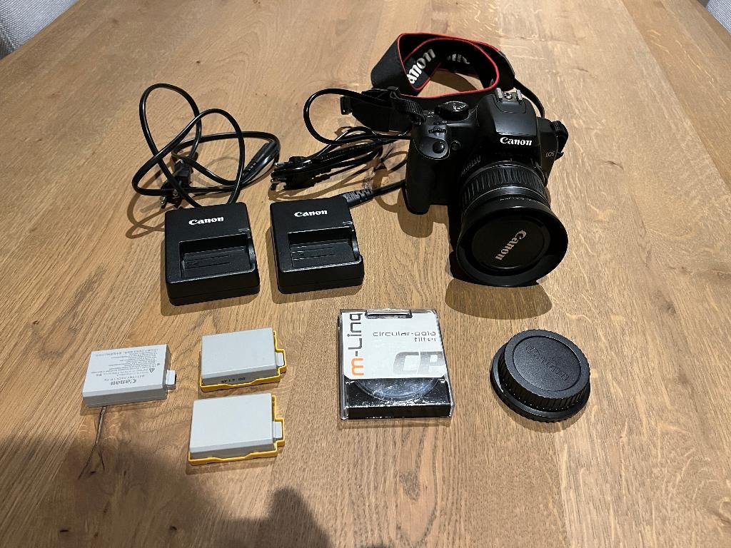 canon 1000d 18-35 mm lens 3 accu's 2 opladers uv pola filter, Gebruikt, Spiegelreflex, Canon, 10 Megapixel