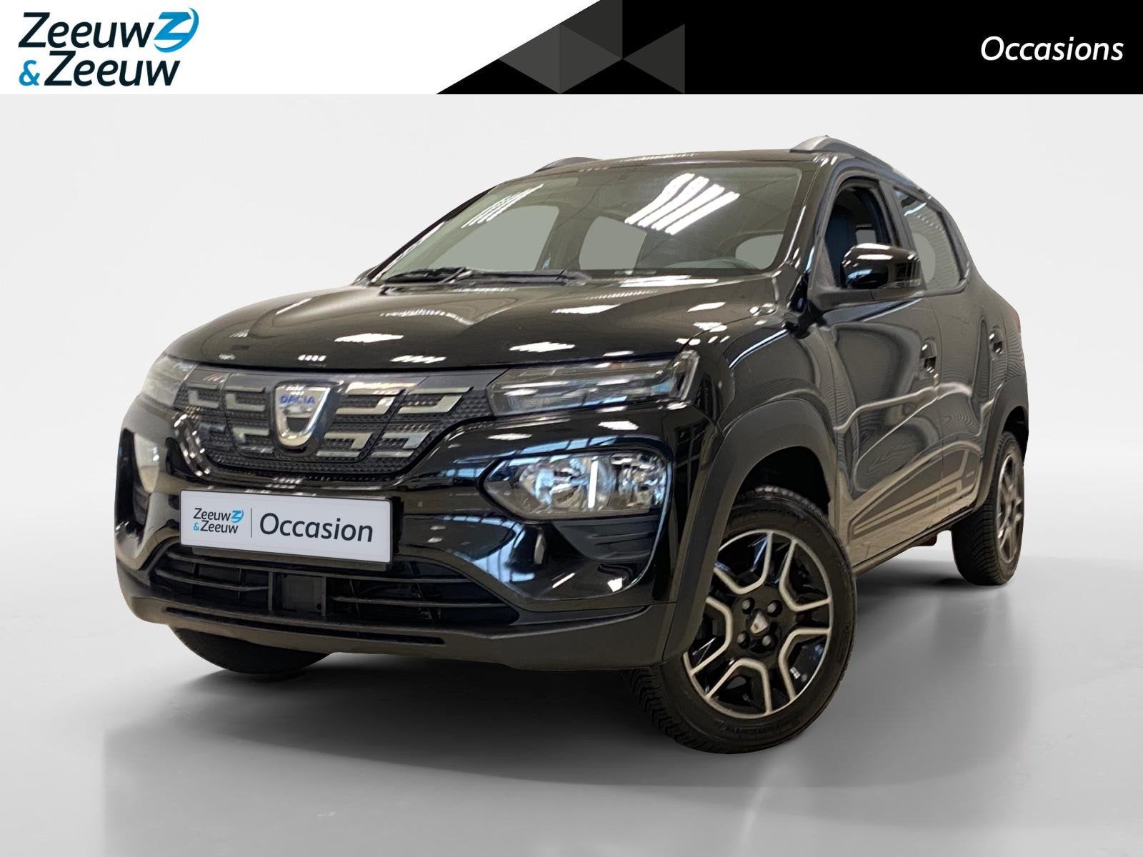 Dacia Spring COMFORT | 27KWH | AIRCO | DEALERONDERHOUDEN |, Auto's, 12 maanden, Gebruikt, Leder en Stof, Zwart