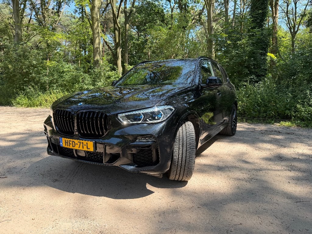 BMW X5 xDrive45e M Sport|ACC|Laser|Massage|Merino|Head-up|, Auto's, Parkeerassistent, 394 pk, Zwart, Leder