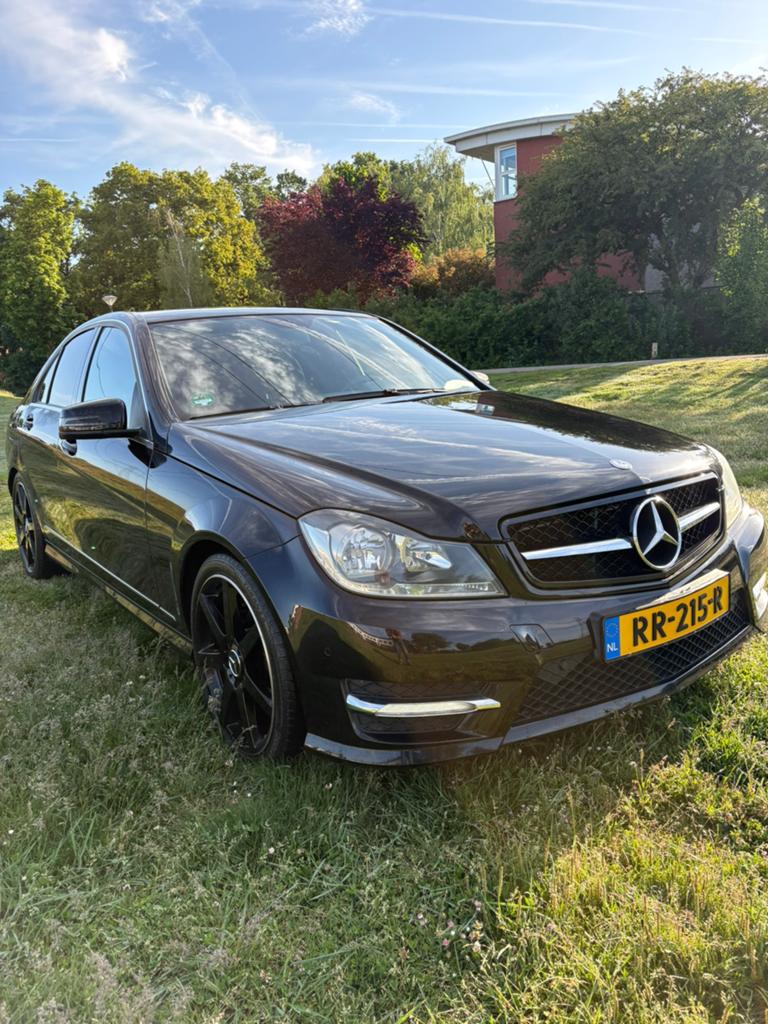 Mercedes-Benz C180 2012 AMG uitgevoerd, Automaat, Achterwielaandrijving, Zwart, 4 cilinders